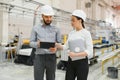 Engineers discussing production in window factory Royalty Free Stock Photo