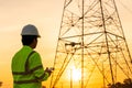 Engineers or Electrician use drone to fly inspections at the electric power station to view the planning work by producing