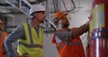 Engineers examining fire extinguishers on power plant