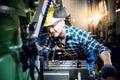 Engineers Caucasian man are working by controlling steel lathes Royalty Free Stock Photo