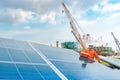 Engineers hold a tool for checking the performance of the solar panel to confirming systems working normally. Photovoltaic module