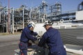 Engineers inside oil refinery