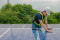 Engineers inspect the solar panel surface neatly.