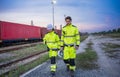 Engineers Inspecting Freight Operations at Rail Yard, Logistics Team on Duty at Industrial Train Terminal, Logistics Team Royalty Free Stock Photo