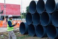 Engineers are inspecting the readiness and completeness of a large construction project involving pipe laying and road Royalty Free Stock Photo