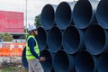 Engineers are inspecting the readiness and completeness of a large construction project involving pipe laying and road Royalty Free Stock Photo