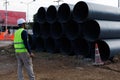 Engineers are inspecting the readiness and completeness of a large construction project involving pipe laying and road Royalty Free Stock Photo