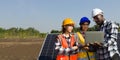 Engineers installing solar panels for use in agriculture Royalty Free Stock Photo