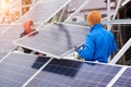 Engineers installing solar panels in winter Royalty Free Stock Photo