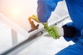 Engineers installing solar panels. Worker with tools maintaining photovoltaic panels Royalty Free Stock Photo