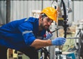 Engineers mechanic using computer controller Robotic arm for welding steel in steel factory workshop. Industry robot programming