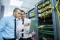 It engineers in network server room Royalty Free Stock Photo