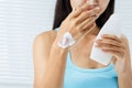 Woman is using a skin cream. Royalty Free Stock Photo