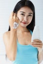 Woman is using a skin cream. Royalty Free Stock Photo