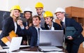 Engineers posing in front of smartphone Royalty Free Stock Photo