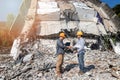 Engineers shaking hands in demolish building. Agreement between structural engineers and contractors after agreeing the cost of Royalty Free Stock Photo