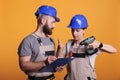 Engineers team looking at construction measurements Royalty Free Stock Photo