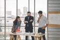 Engineers team meeting for architectural project. architects discussing blueprint with construction manager in office worker