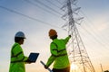 Engineers and Technician working inspections at the electric power station to view the planning work by producing electricity high