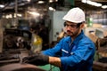 Engineers and technicians Holding a tablet computer In the factory. Technicians and engineers are working of machinery in Royalty Free Stock Photo