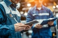 Engineers in Uniform Conducting Inspection and Recording Data Digital Tablets Royalty Free Stock Photo