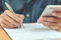 Engineers using a pen recorded data on the desk