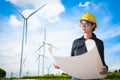 Engineers woman windmills for production of electric power on ba