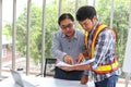 Engineers working meeting room at the office. Three workers are talking construction plan. Electricians carpenter or Technical Royalty Free Stock Photo