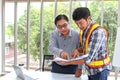 Engineers working meeting room at the office. Three workers are talking construction plan. Electricians carpenter or Technical Royalty Free Stock Photo