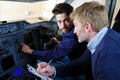 Engineers working in plane cockpit Royalty Free Stock Photo