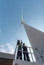 Engineers working on site in wind turbine farm, Wind turbines generate clean energy source, Eco technology for electric Royalty Free Stock Photo