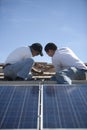 Engineers Working On Solar Panelling At Rooftop Royalty Free Stock Photo