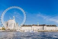 England London - April 20, 2019: London Eye near County Hall in summer view from Thame river boat cruise.