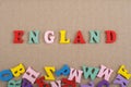 ENGLAND word on paper background composed from colorful abc alphabet block wooden letters, copy space for ad text