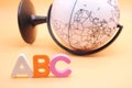 English ABC alphabet letters next black and white globe Royalty Free Stock Photo