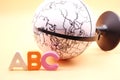 English ABC alphabet letters next black and white globe Royalty Free Stock Photo