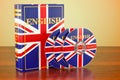 English book with flag of UK and CD discs on the wooden table. 3