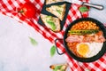 English breakfast concept with avocado toast over blue vintage background. Royalty Free Stock Photo