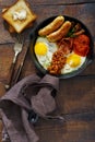 English breakfast on dark wooden table, top view Royalty Free Stock Photo