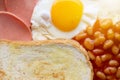 English breakfast: fried egg, bacon, beans and toast Royalty Free Stock Photo