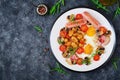 English breakfast - fried egg, beans, tomatoes, mushrooms, bacon and sausage. Royalty Free Stock Photo