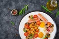 English breakfast - fried egg, beans, tomatoes, mushrooms, bacon and sausage. Royalty Free Stock Photo