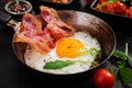 English breakfast - fried egg, beans, tomatoes, mushrooms, bacon Royalty Free Stock Photo