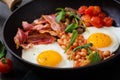 English breakfast - fried egg, beans, tomatoes, mushrooms, bacon Royalty Free Stock Photo