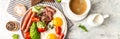 English breakfast. Fried egg, sausage, bacon, avocado, beans and toast on white background Top view, overhead, banner Royalty Free Stock Photo