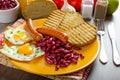 English breakfast - garlic toast, fried egg, beans and English breakfast, toast, egg, beans, sausages Royalty Free Stock Photo