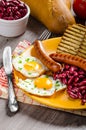 English breakfast - garlic toast, fried egg, beans and English breakfast, toast, egg, beans, sausages Royalty Free Stock Photo