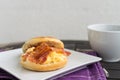 English breakfast. Salt muffin with scrambled eggs, bacon and ch Royalty Free Stock Photo