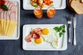 English Breakfast with scrambled eggs and bacon, carrot juice, b Royalty Free Stock Photo
