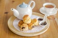 English breakfast and tea break. scones on wooden table with a cup of tea.